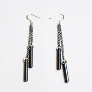 Factory Floor Jewels Steel Rods earrings on white background