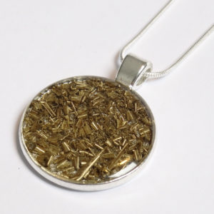 Factory Floor Jewels swarf pendant close up on white background