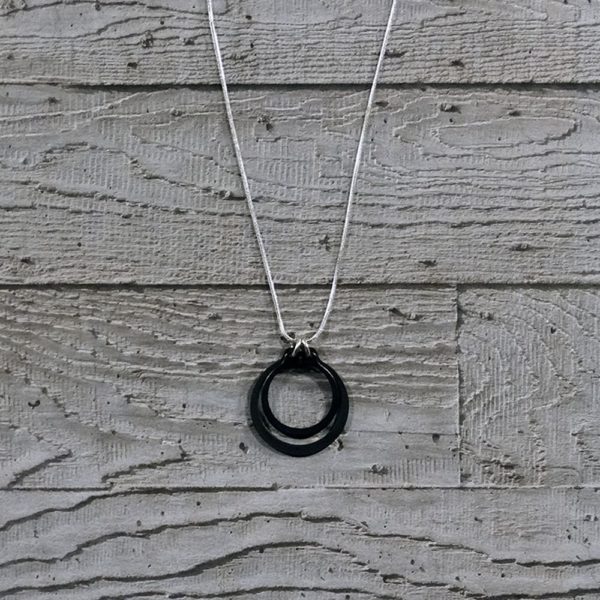 black and silver circlips pendant by factory floor jewels