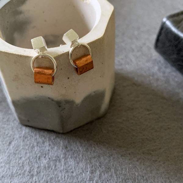 silver earrings with copper tubes