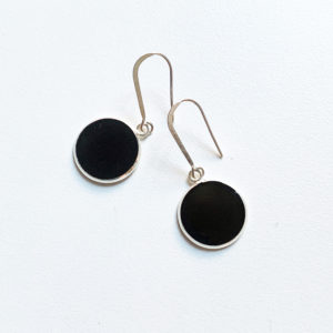 black art deco earrings on white background