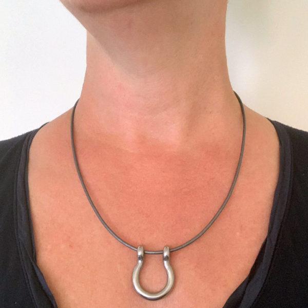 leather shackle necklace being worn