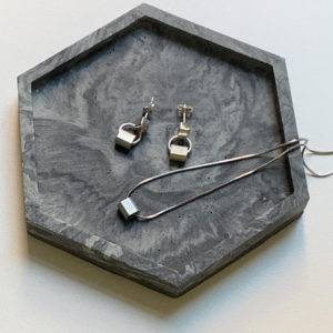 Silver cube and alu studs on a tray