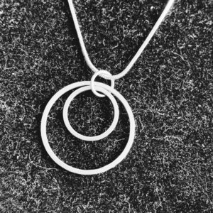 steel pendant on a black background
