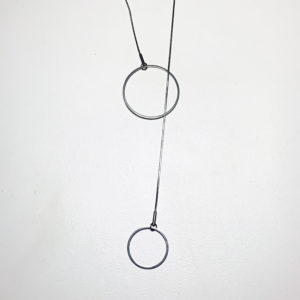 Steel lariat pendant with 2 circles shown on a white background