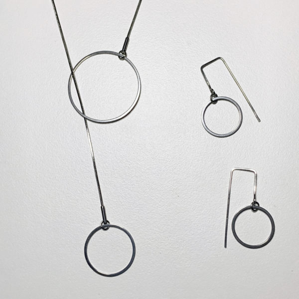 steel lariate pendant and co-ordinating earrings