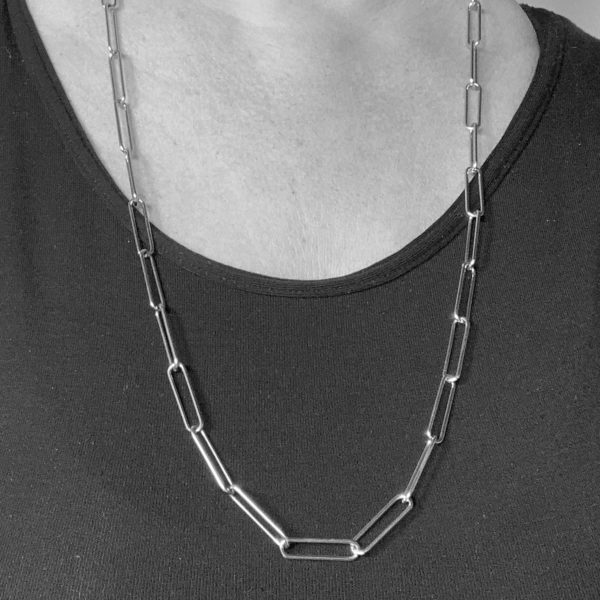 Black and white photo of woman wearing a 28 inch steel paperclip chain