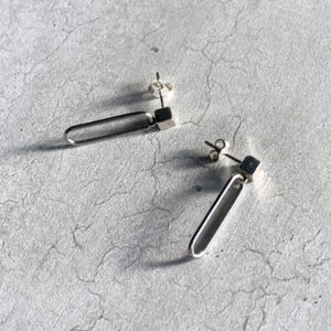steel paperclip earrings on a sterling silver cube stud