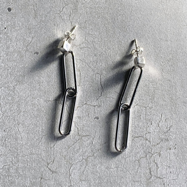 double link steel paperclip earrings on a sterling silver cube stud