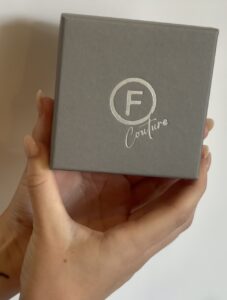 Factory Floor Jewels Couture box being held up