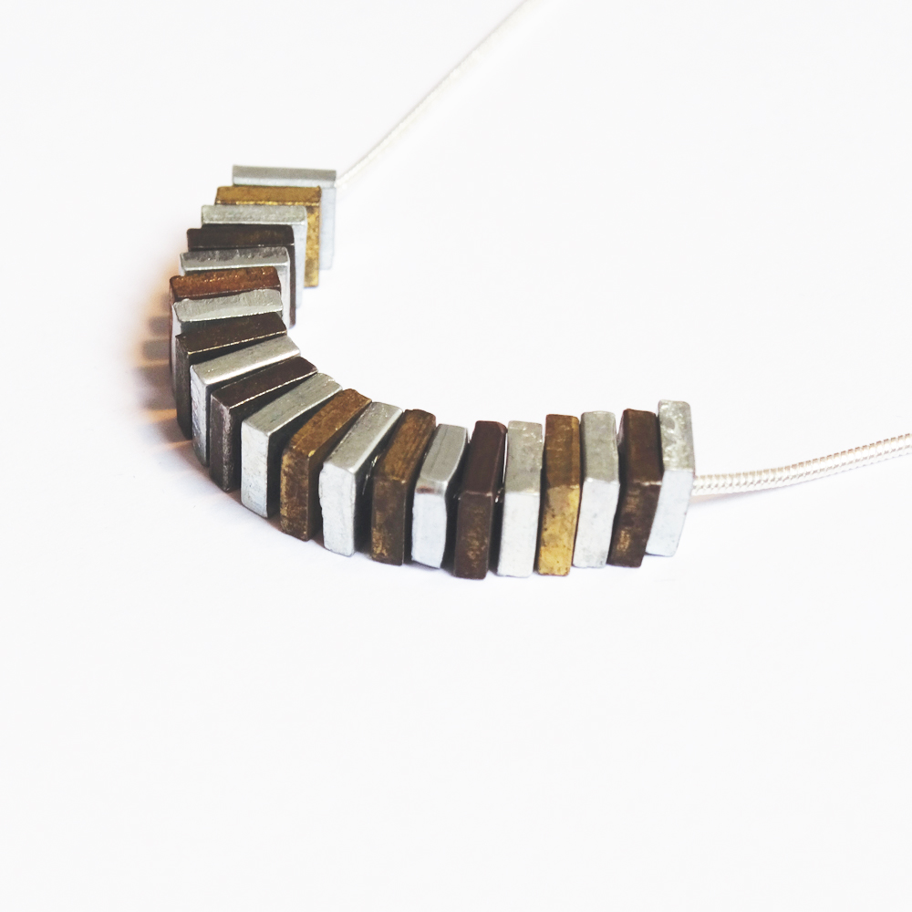 Mixed metal nuts on a steel snake chain by Factory Floor Jewels