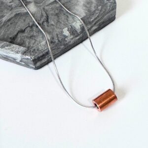 Copper 'weight' pendant on stainless steel snake chain